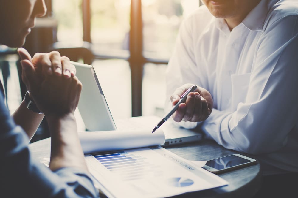 Founders comparing entity formation choices at a meeting table
